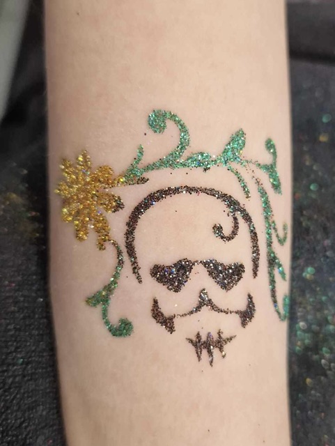 glitter tattoo in the shape of a skull in Telford